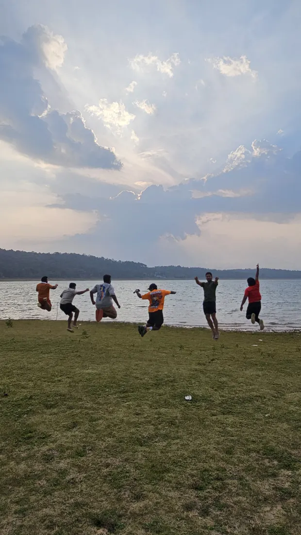 Jumping by the lake with friends